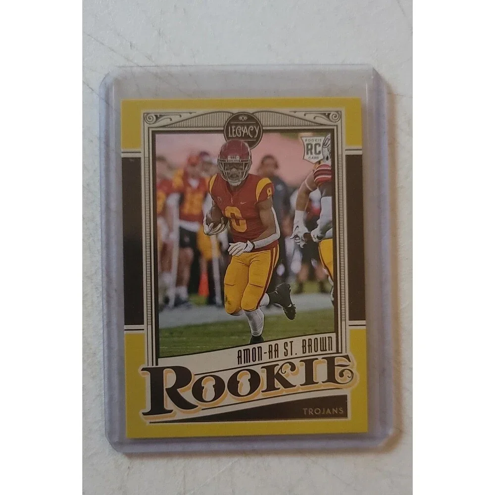 2021 Panini Legacy - Rookies Amon-Ra St. Brown #155 Yellow 14/150 (RC)